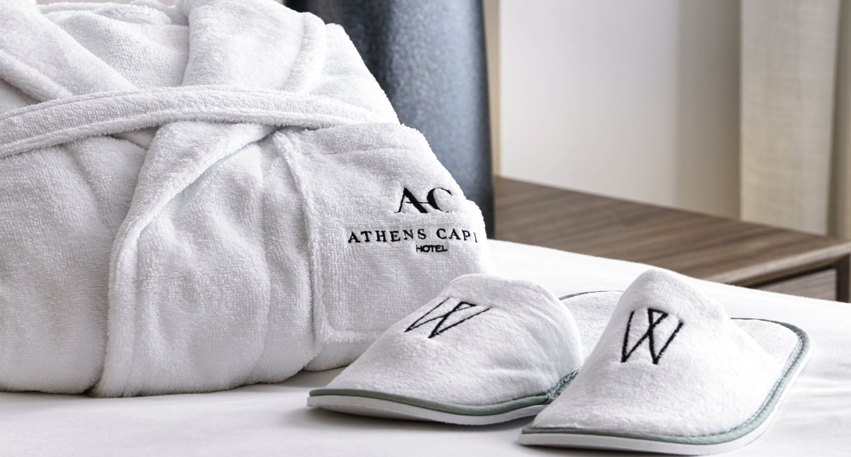 Athens Capital Hotel robe and slipper amenities