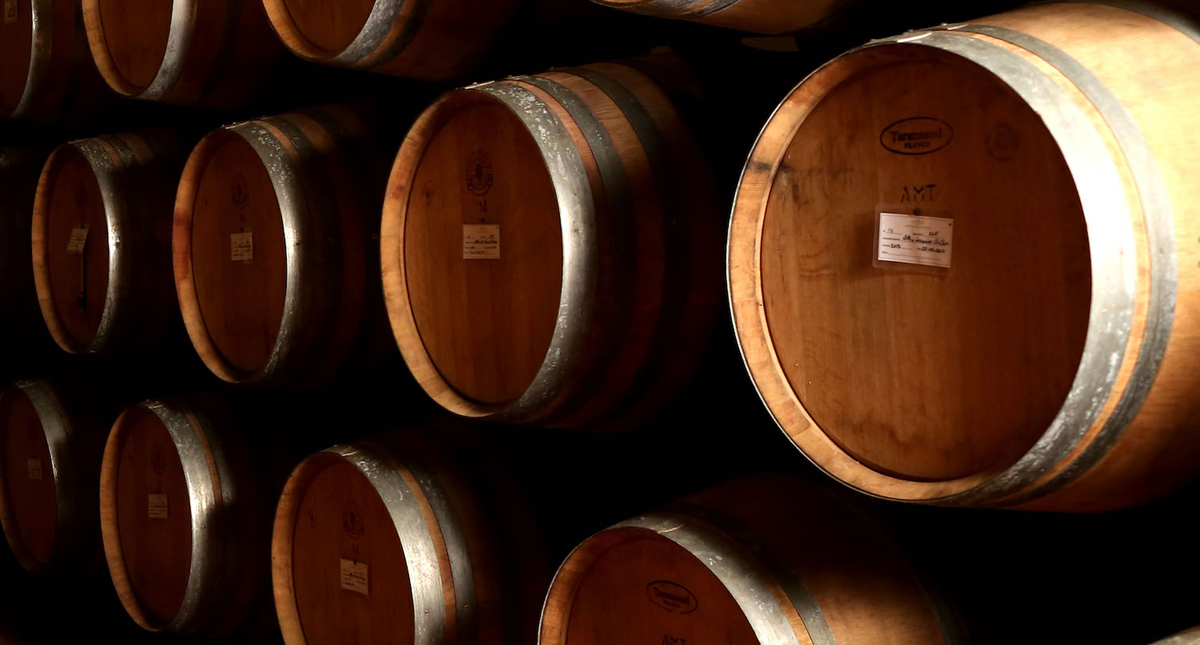 Castello La Leccia stacked wine barrels