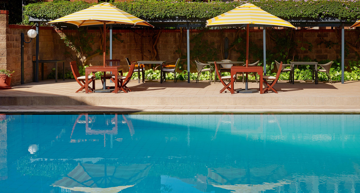 Fairmont The Norfolk outdoor pool and umbrella seating