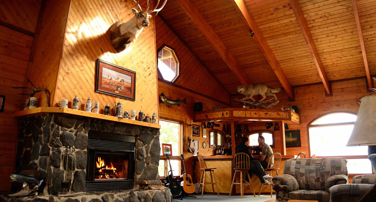 Gangler's North Seal River Lodge main lodge fireplace seating