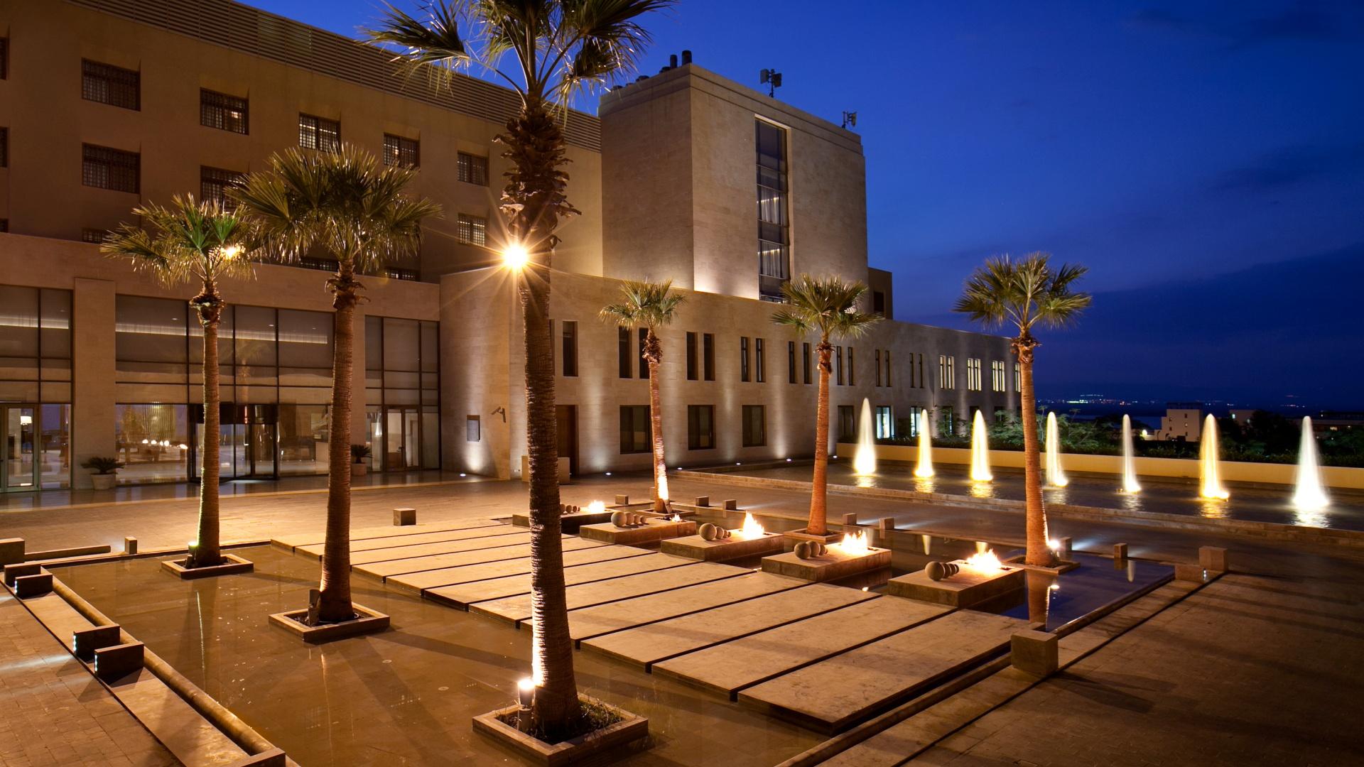 Kempinski Hotel Ishtar Dead Sea courtyard illuminated at night