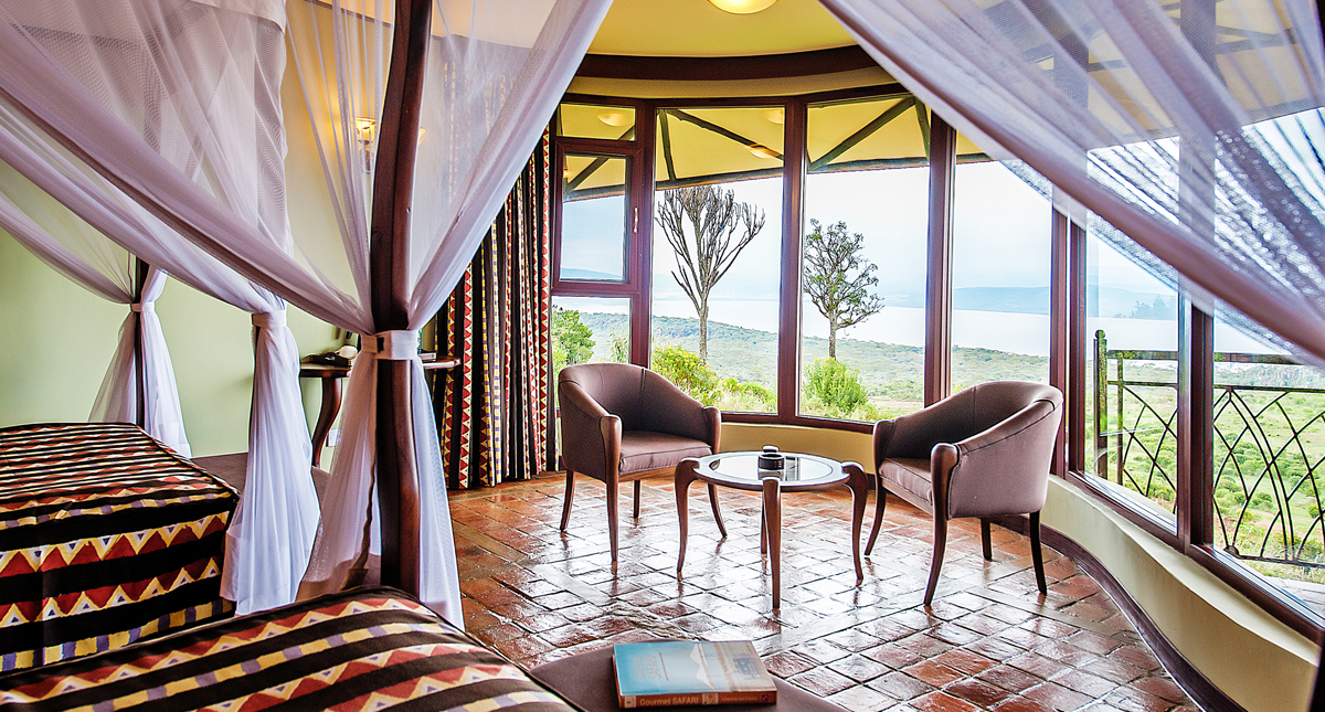 Lake Nakuru Sopa Lodge bedroom and sitting area of guest lodge
