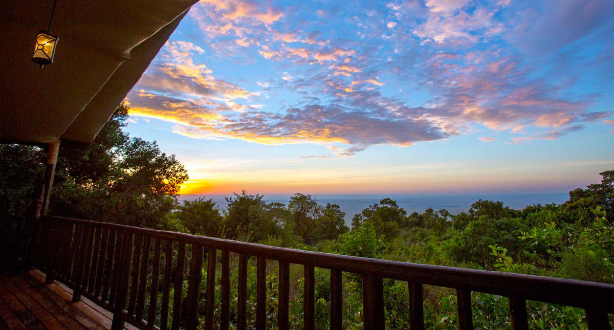 Mara Engai Lodge guest lodge view over the jungle at sunset