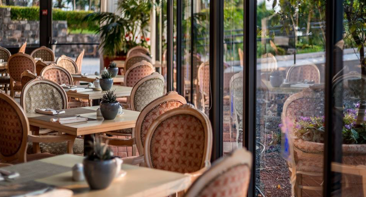 The Scots Hotel casual dining area with outdoor views