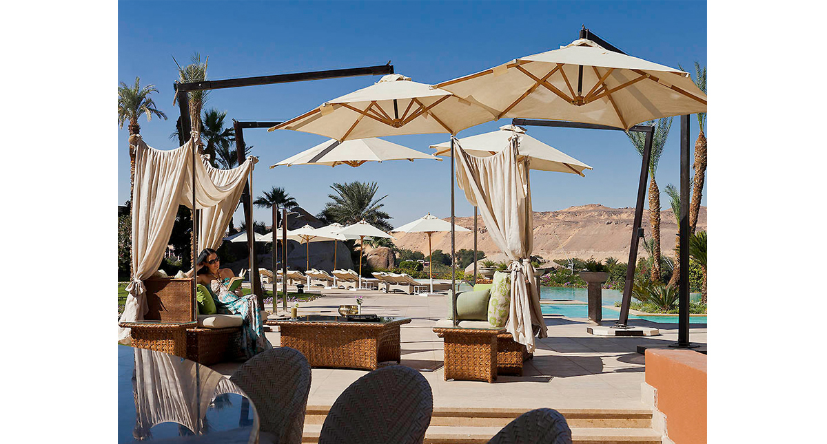 Sofitel Old Cataract Hotel outdoor pool with umbrella covered sitting area