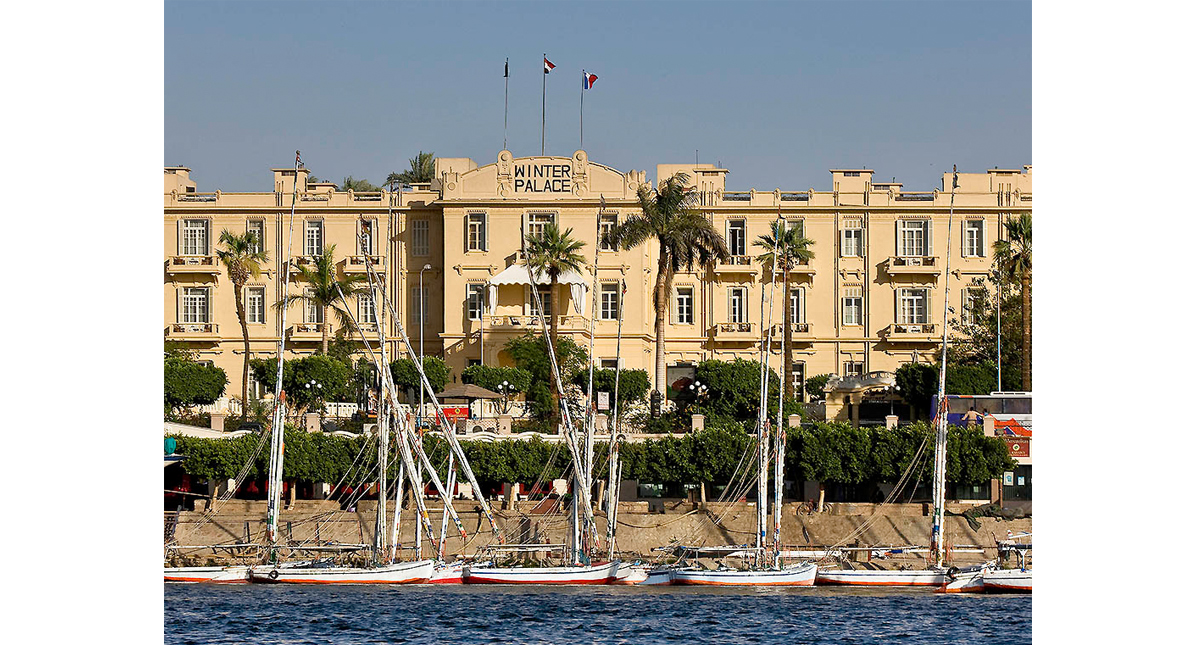 Winter Palace Hotel exterior view with Nile River in foreground