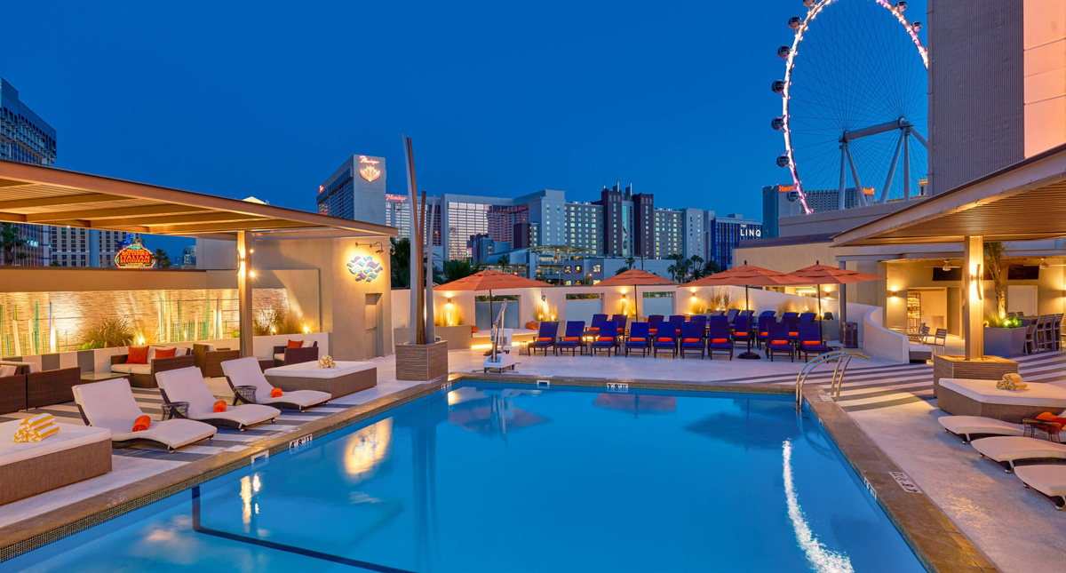 The Westin Las Vegas Hotel & Spa outdoor pool at night with ferris wheel in background