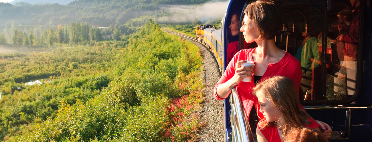 Family perched on viewing car on the Alaska Railroad