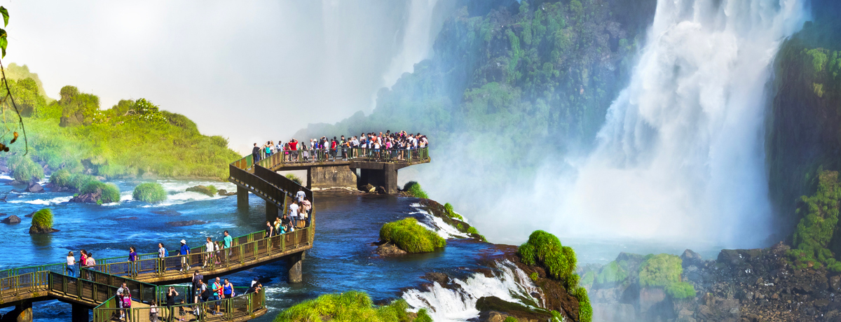 Guests on walkway overlooking Iguazu Falls waterfalls