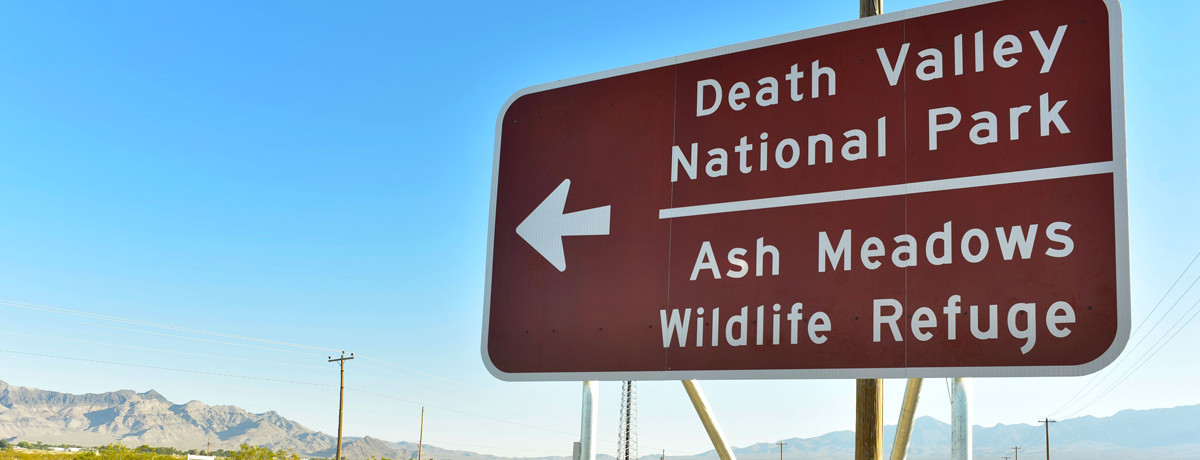 Arrow road sign for Death Valley in Pahrump, Nevada