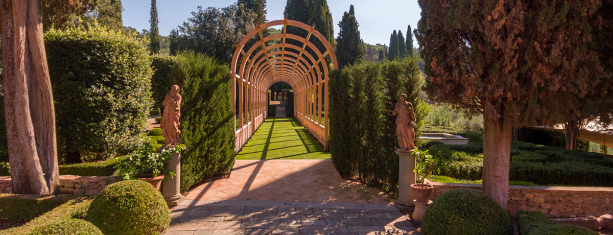 Villa Vignamaggio arched walkway through gardens