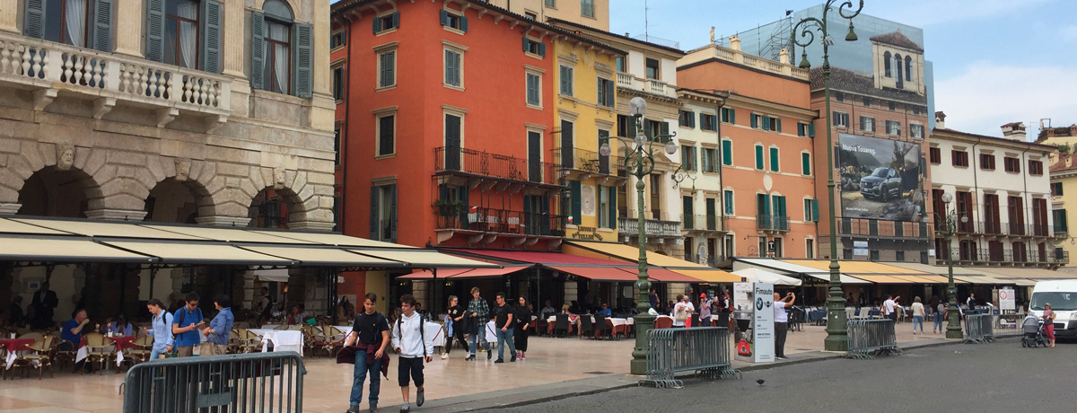 Bustling Verona street with cafes and restaurants