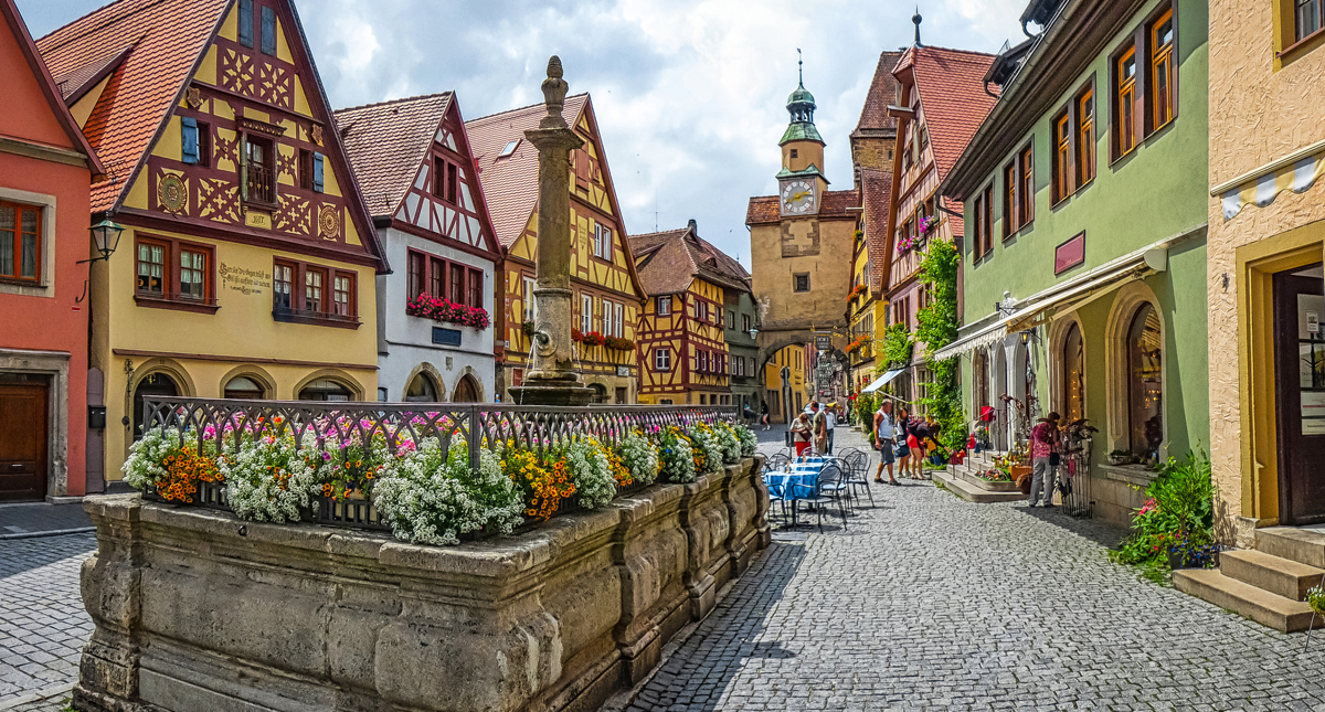 Colorful homes lining charming cobblestone street