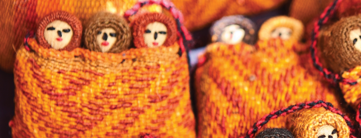 Display of colorfully sewn Peruvian miniature dolls