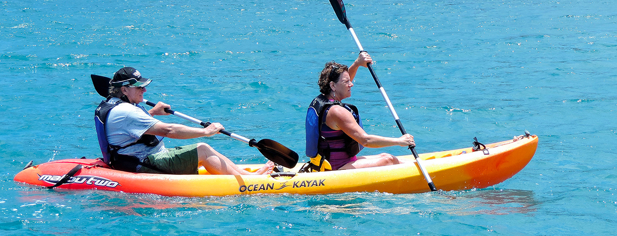 Guests kayaking through the water