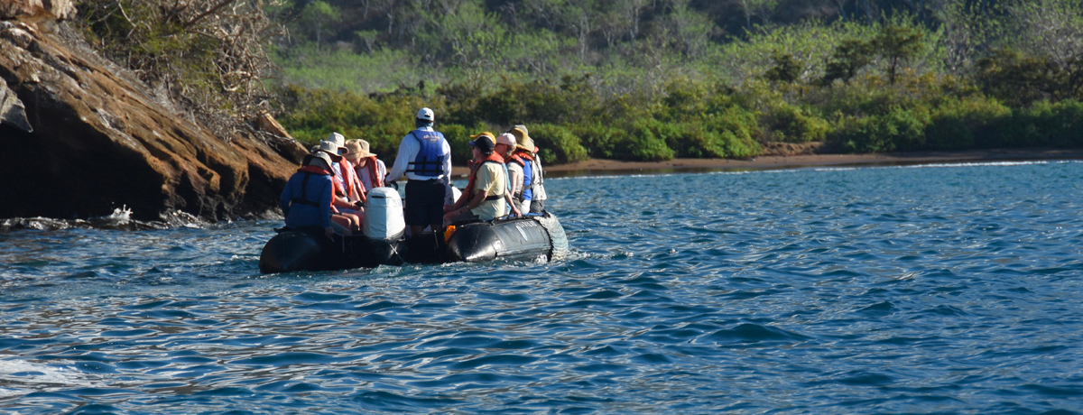 Guests embarking on a skiff ride to shore