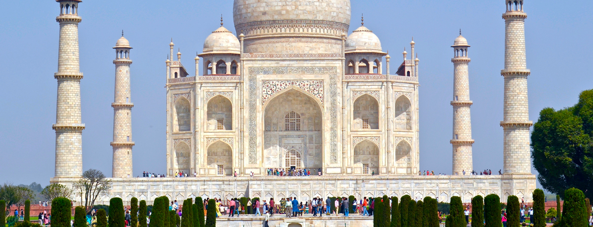 Taj Mahal with guests walking the grounds
