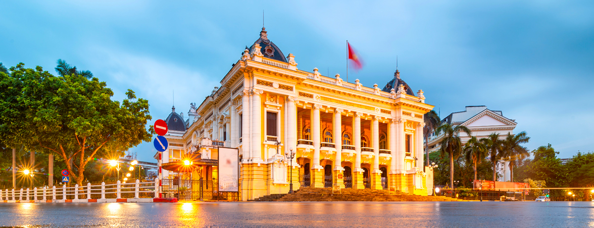 Street view of the Hanoi Opera House at dusk