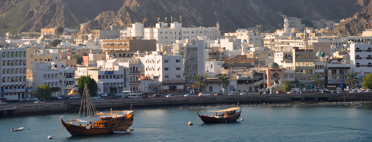 Harbor view of Muscat's cityscape