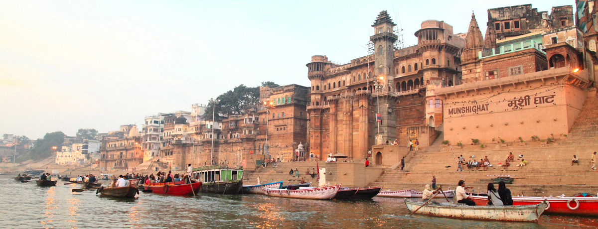 Ganges River with boats lined along the shore