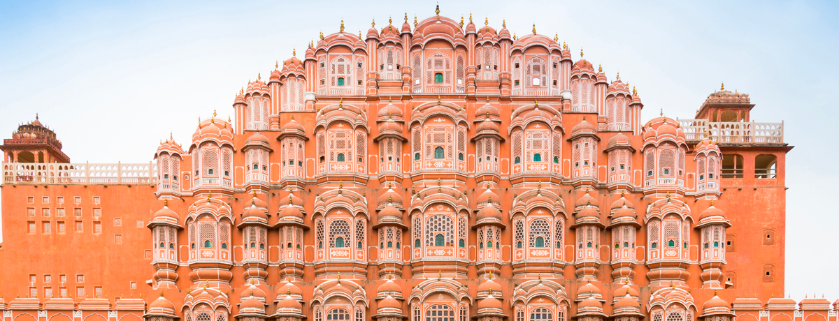Red exterior facade of Hawa Mahal Palace in Jaipur