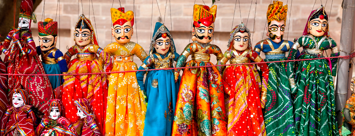 Handmade Rajasthan puppets hanging on display in a shop in Jodhpur City Palace