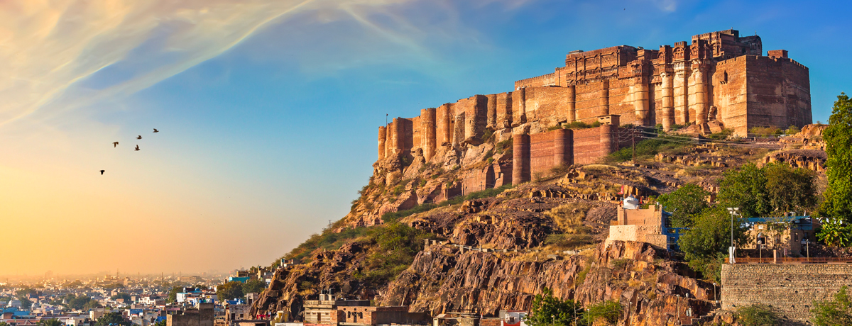 Mehrangarh Fort — a UNESCO World heritage site — with Jodhpur city scape panorama at sunset