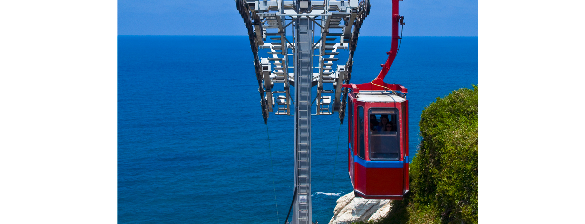 Rosh Hanikra cable car gliding from the hilltop to the sea shore
