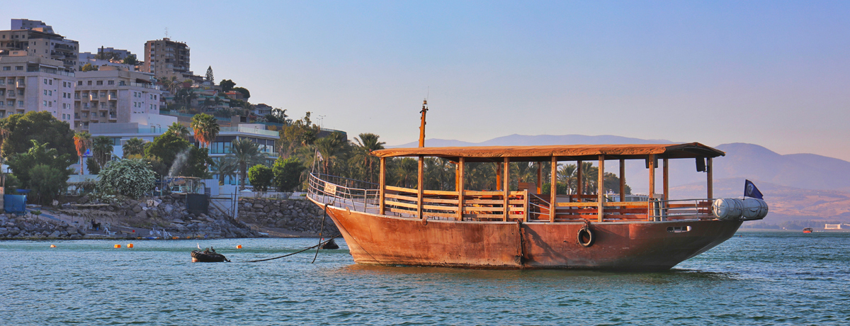 Wooden boat moored in the harbor at the Sea of Galilee