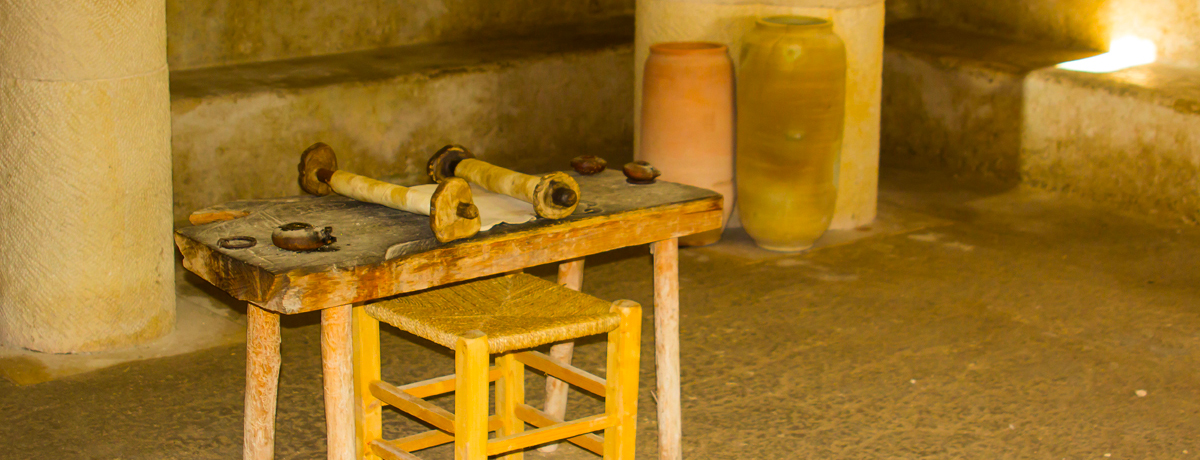 A small wooden table holding a Torah Scroll in the Synagogue in the open air museum of Nazareth Village 