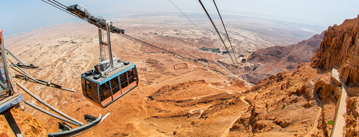 Cable cars traveling over Masada