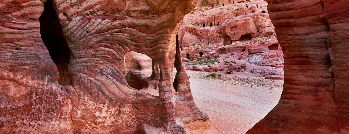 Red stone walls inside the ancient city of Petra, Jordan