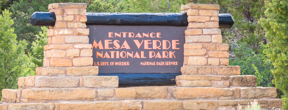 Stone sign that reads Entrance Mesa Verde National Park