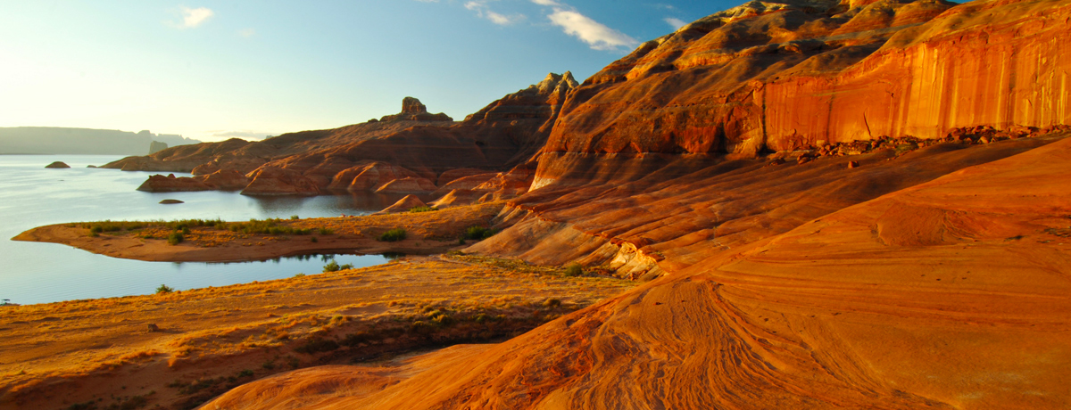 Red sandstone formations along the shore of Lake Powell