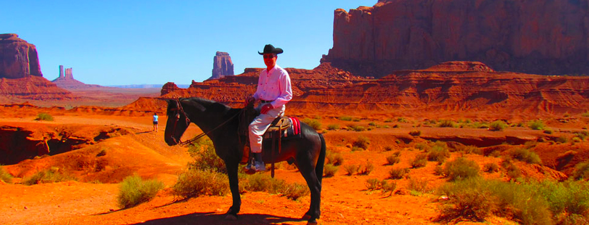 Man on horseback in the desert