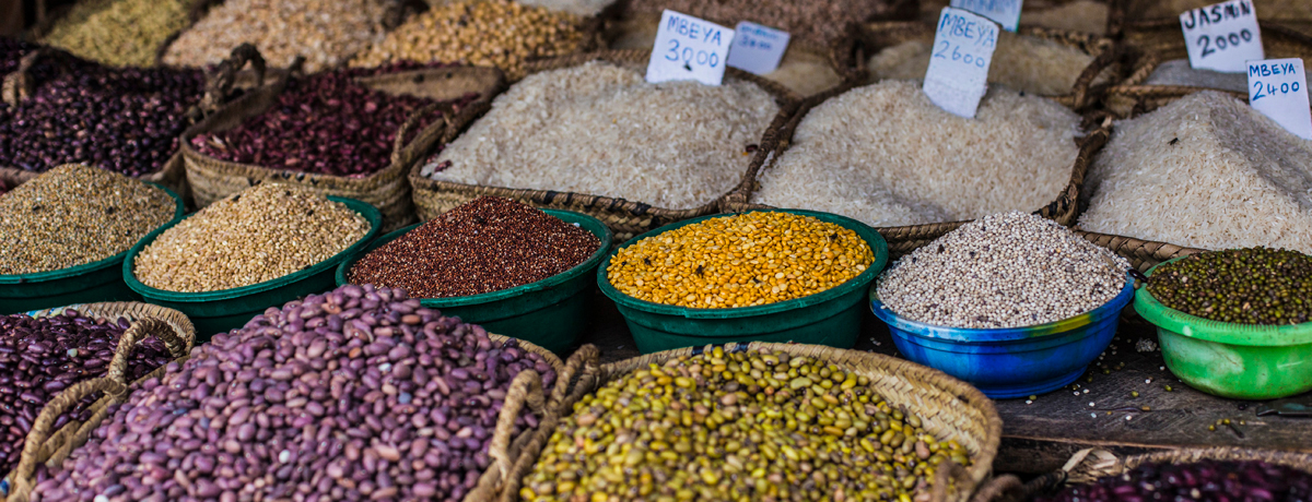 Barrels of colorful spices on display at market