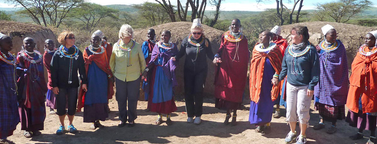 Maasai celebrating with visitors