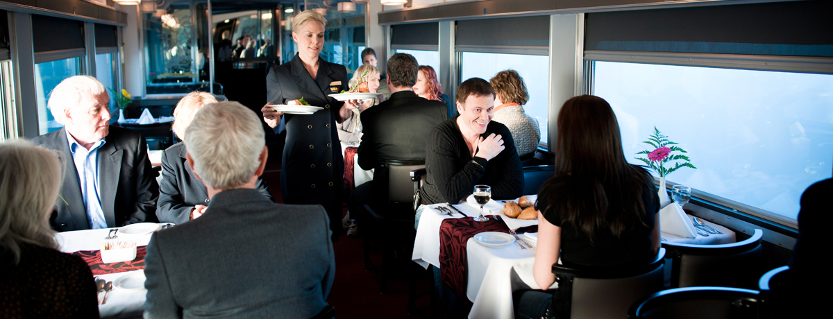 Guests joining for dinner in the dining car