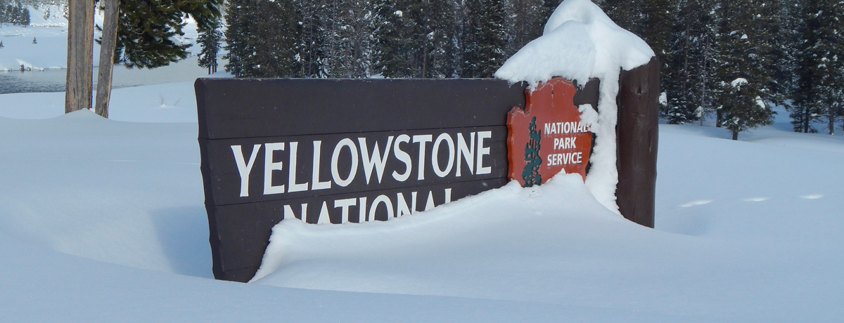 Snow covered Yellowstone park entry sign