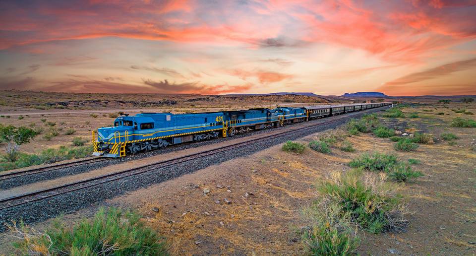 african explorer on rails during sunset