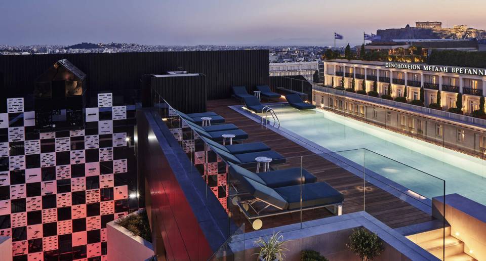 Athens Capital Hotel outdoor pool at dusk