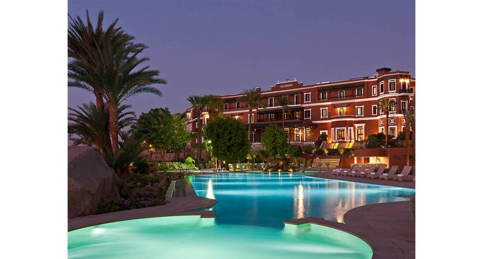 Sofitel Old Cataract Hotel evening view of outdoor pool and patio