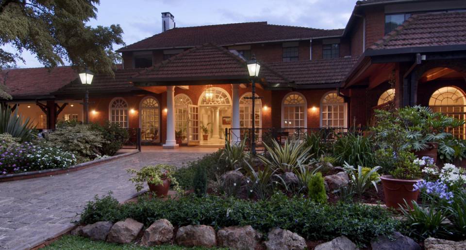 Fairmont The Norfolk courtyard gardens at dusk