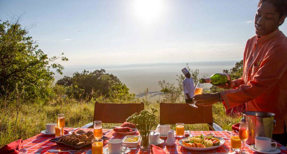 Mara Engai Lodge staff preparing outdoor breakfast service