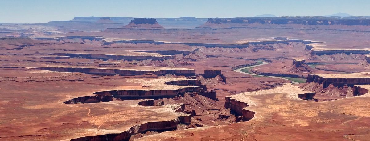 Vast desert landscape with deep craters