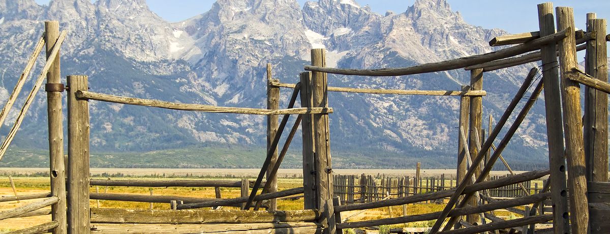 Wooden fence with mountains in background