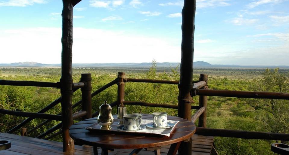 Kirawira Serena Camp guest tent porch with views overlooking the grounds
