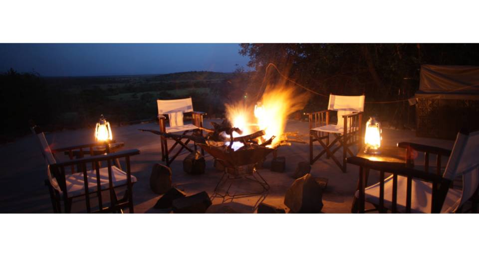 Mbalageti Serengeti Tented Chalets outdoor patio at night