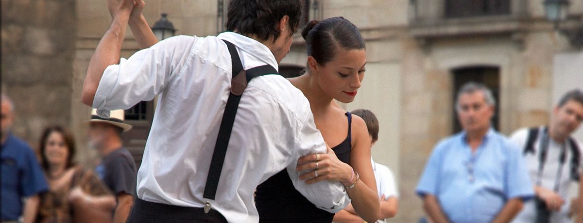 Street performers dancing for audience in Barcelona