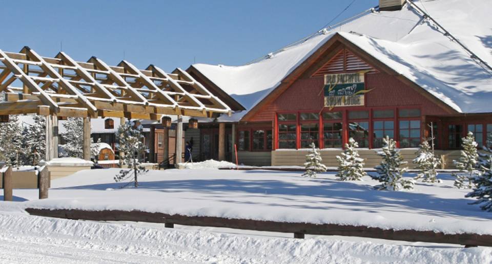 Old Faithful Snow Lodge exterior covered in snow